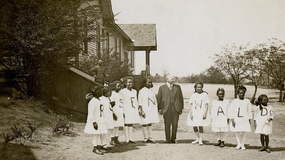 Philanthropist Julius Rosenwald and some of the students from a Rosenwald school.