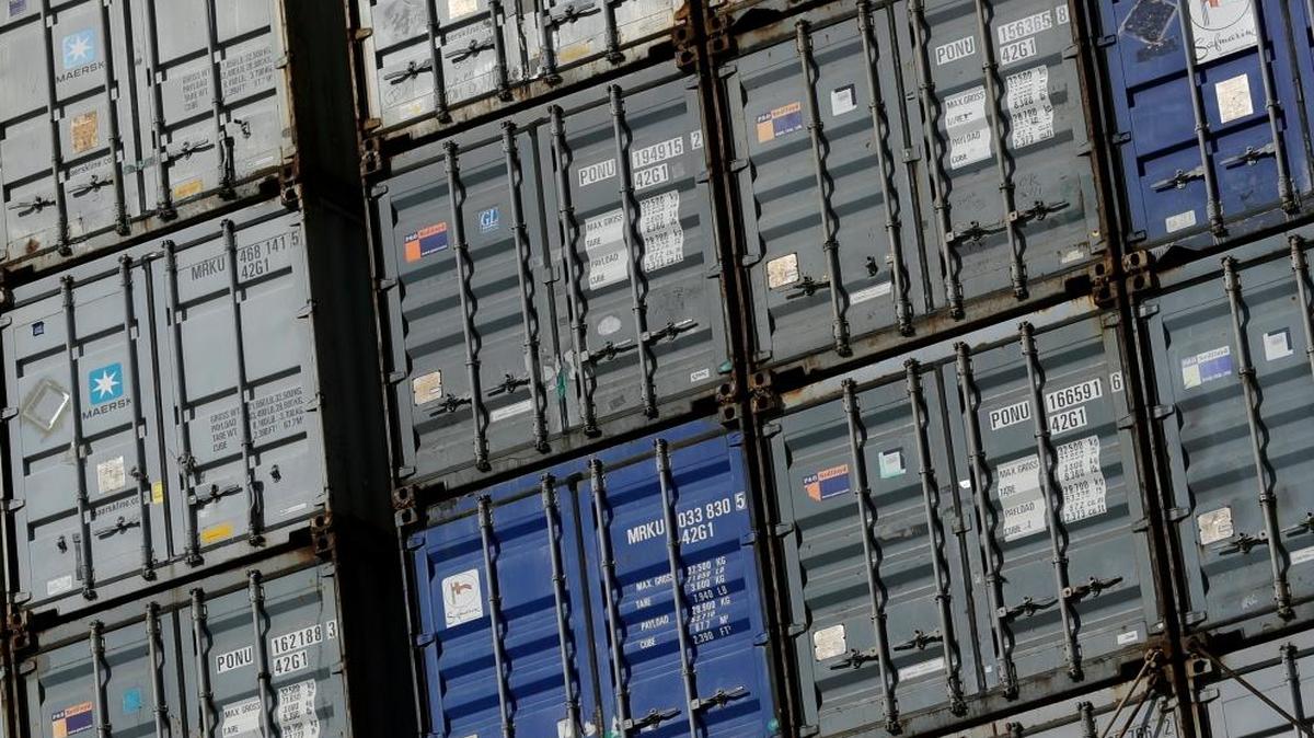 Containers wait to be unloaded from a ship at the Port of Baltimore in Baltimore. Shipping is one of the sectors that could be disrupted by the blockchain technology that underpins bitcoin.