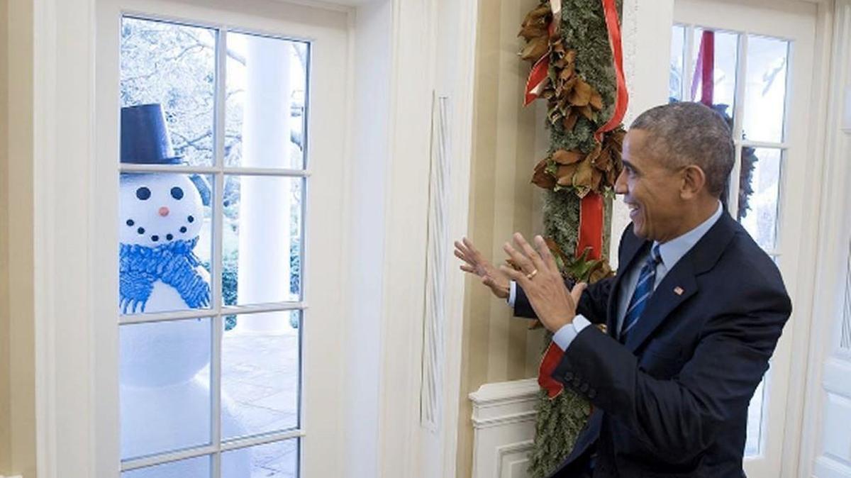 The president feigns surprise at the snowman outside the Oval Office.