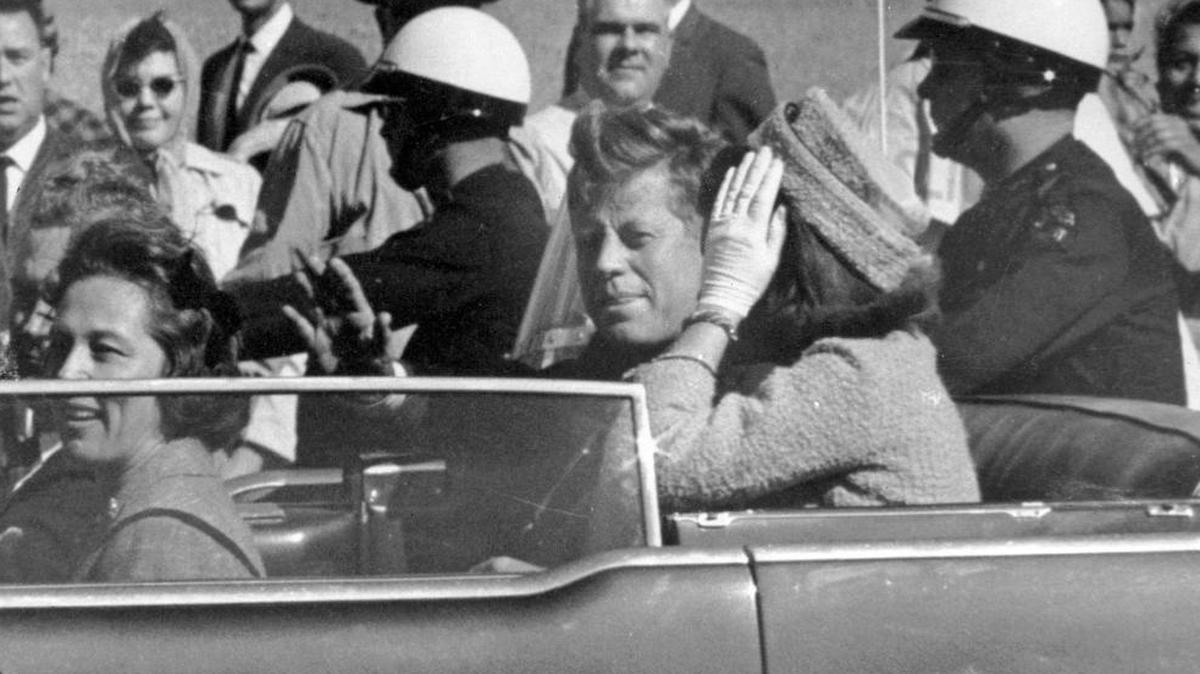 President John F. Kennedy waves from his car in a motorcade in Dallas on Nov. 22, 1963, shortly before he was shot. Riding with Kennedy are First Lady Jacqueline Kennedy, right, Nellie Connally, second from left, and her husband, Texas Gov. John Connally, far left.