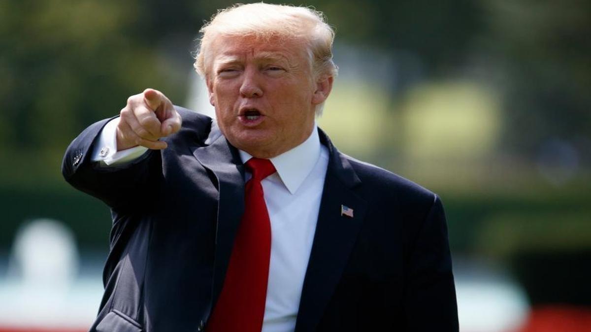 President Donald Trump talks to reporters before boarding Marine One on the South Lawn of the White House in Washington, Wednesday, Aug. 30, 2017, for a short trip to Andrews Air Force Base, Md., then onto Missouri.