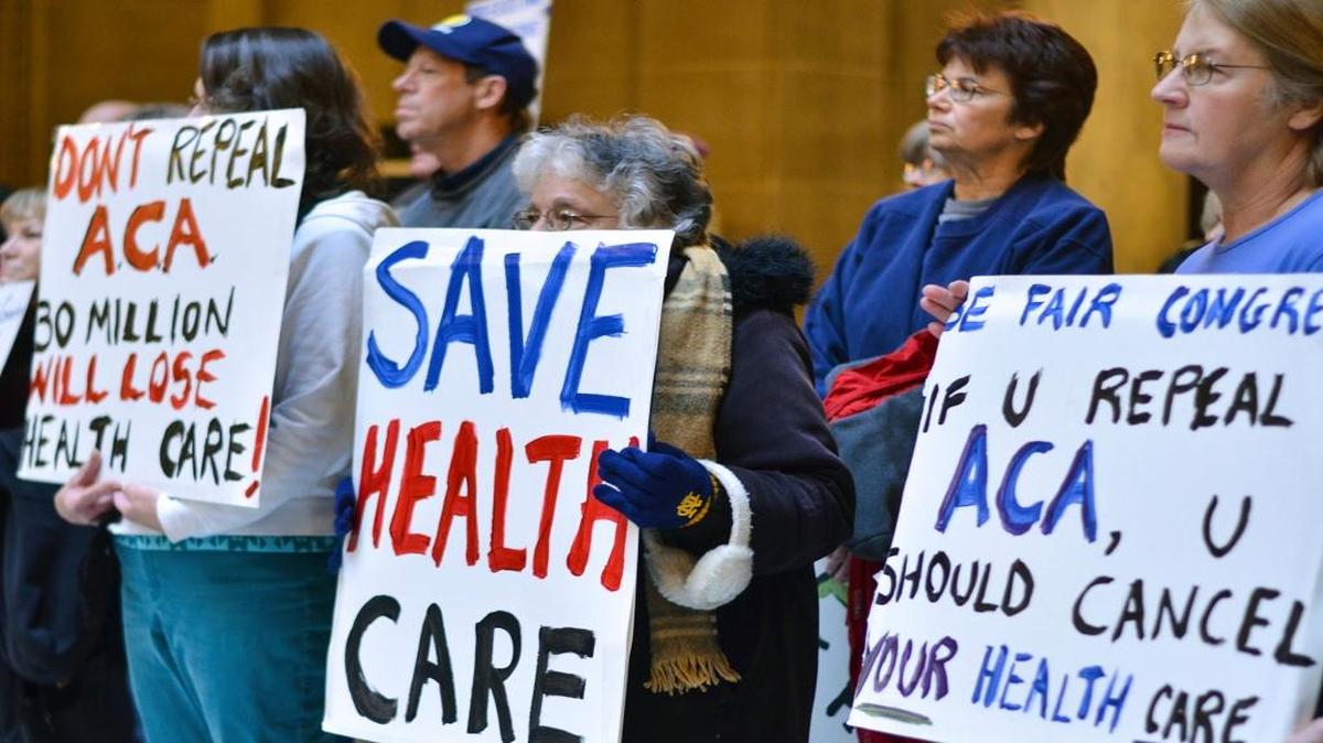 People attend a health care rally at the Indiana Statehouse in support of the Affordable Care Act, Sunday, Jan. 15, 2017, in Indianapolis. President-elect Donald Trump has vowed to overturn and replace the Affordable Care Act, and majority Republicans in Congress have begun the process of repealing it, using a budget maneuver that requires a bare majority in the Senate.