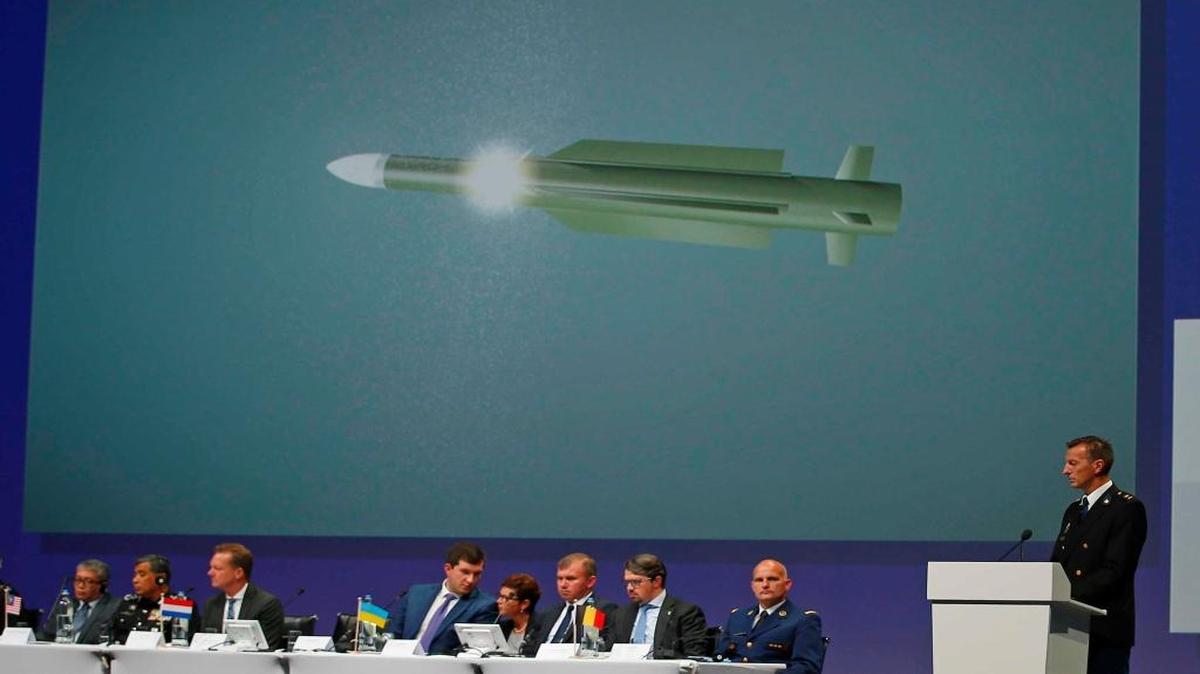 Wilbert Paulissen of the Joint Investigation Team probing the shooting-down of Malaysia Airlines Flight 17 displays a photo of a BUK missile that the group thinks downed the plane, killing 298 crew members and passengers. Leaked emails being published in German news media underscore the extent to which Russian advisers direct the media strategy of separatists in Ukraine’s east.