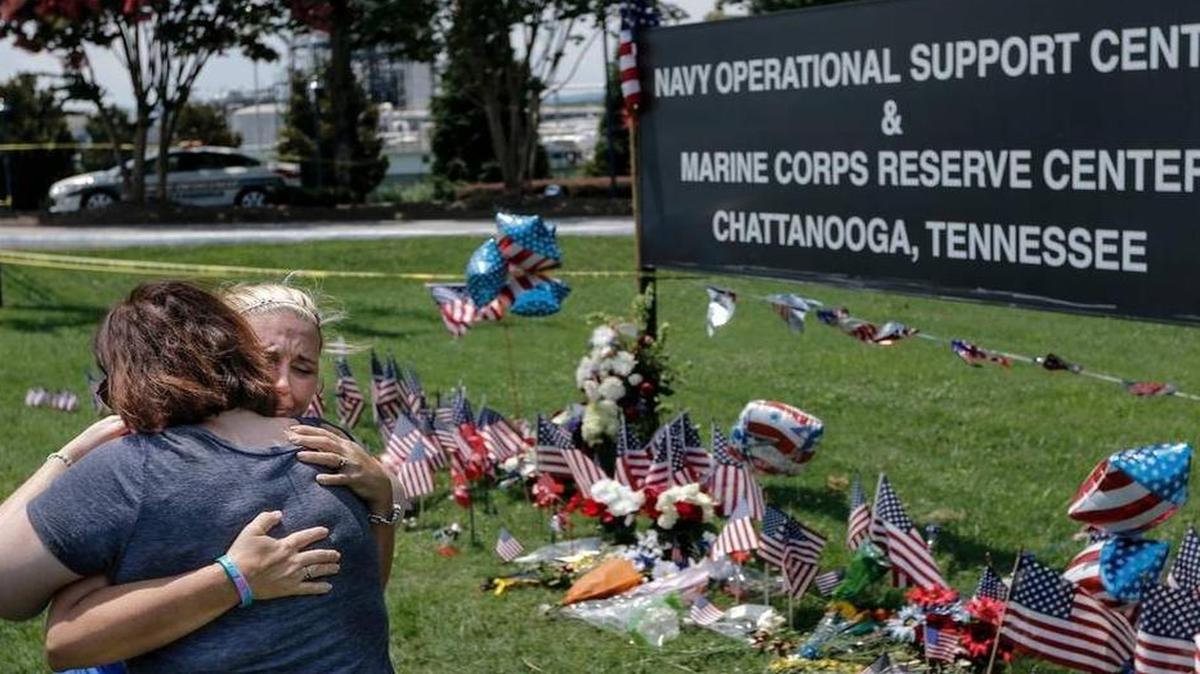 
Mourners embrace at a makeshift memorial at the Navy Operational Support Center and Marine Corps Reserve Center in Chattanooga, Tenn., where five service members were fatally shot.

