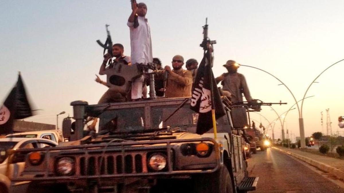 Fighters from the Islamic State group paraded in a commandeered Iraqi security forces in 2014 after they captured Mosul in Iraq.