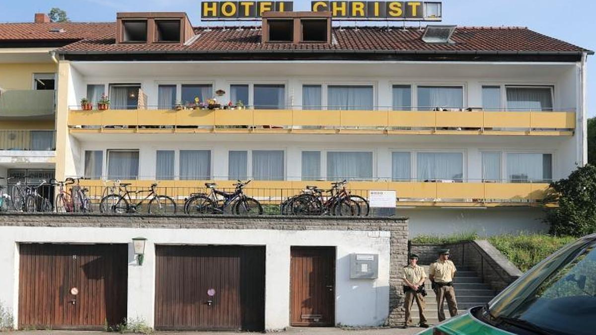 Police officers secure a former hotel where a Syrian man lived before he blew himself in Ansbach, Germany. Bavaria's top security official says the man was a 27-year-old Syrian who’d been denied asylum.