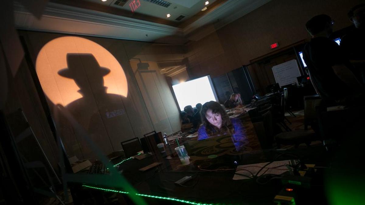A Black Hat tech associate works in the network operating center during the Black Hat information security conference in Las Vegas July 26, 2017.
