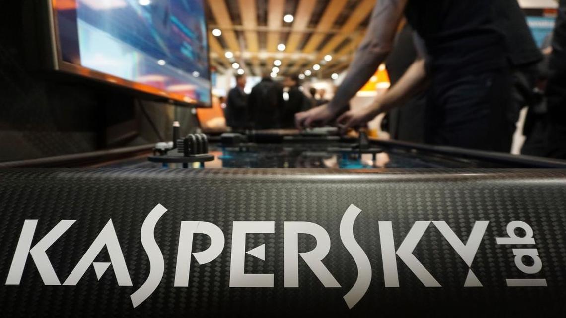 A Kaspersky employee shuffles tokens around a table-top display at the company's stand at a cybersecurity conference in Lille, northern France, on Wednesday, Jan. 25, 2017. Kaspersky says a senior manager at the firm was arrested in Moscow.