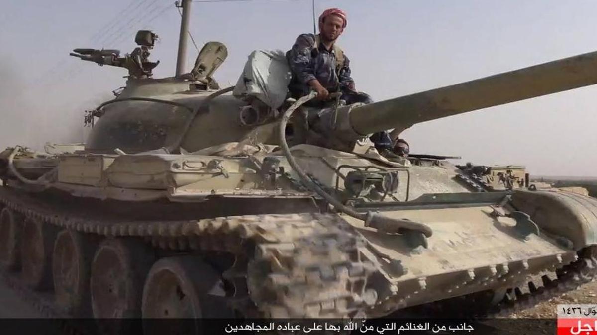 
An Islamic State militant in a Syrian government tank captured Aug. 5 at Qaryatain in central Syria.
