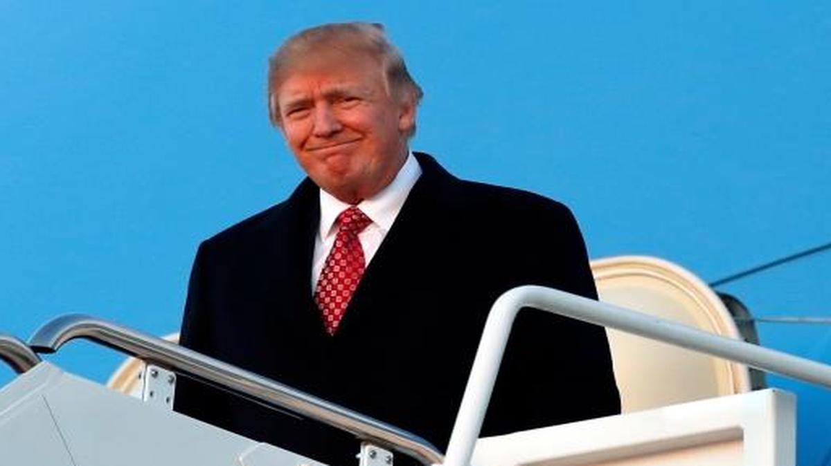 President Donald Trump disembarks from Air Force One as he arrives Sunday, March 5, 2017, at Andrews Air Force Base, Md.