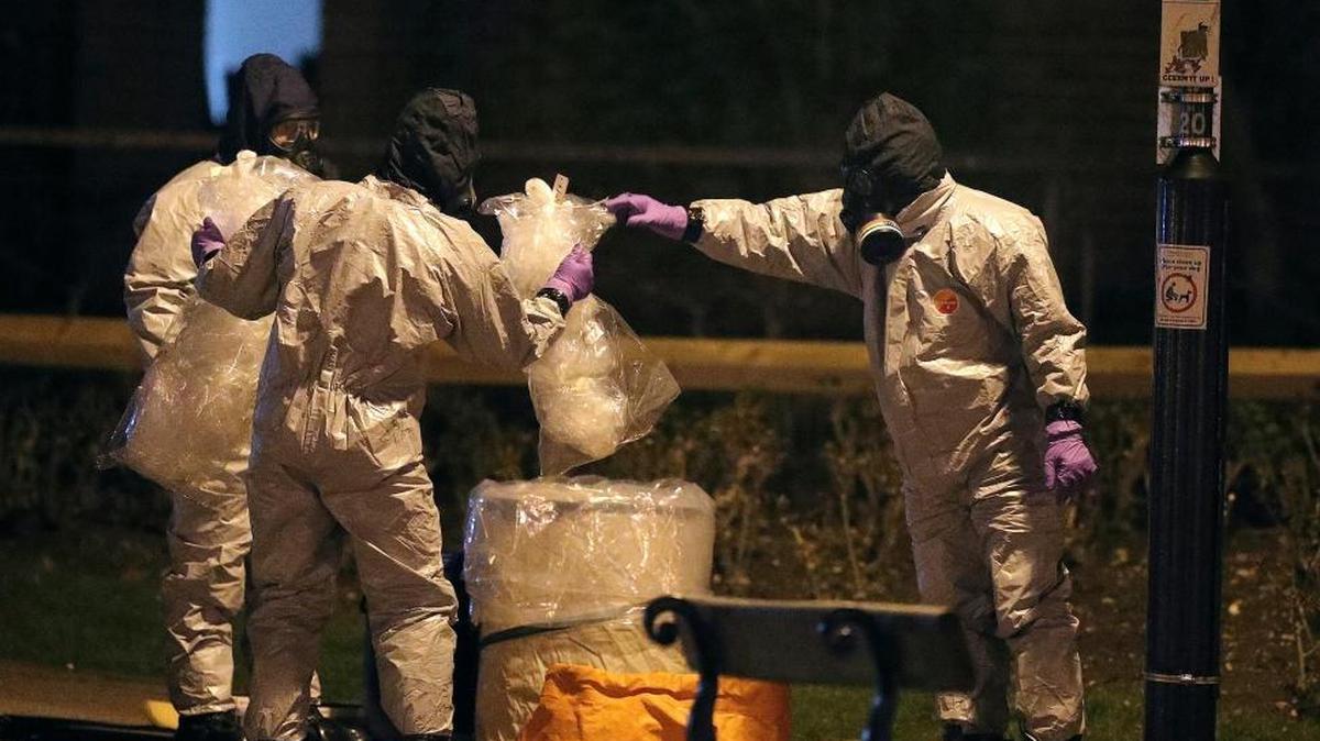 Investigators in protective suits work at the scene in Salisbury, England last week. The use of Russian-developed nerve agent Novichok to poison ex-spy Sergei Skripal and his daughter makes it "highly likely" that Russia was involved, British Prime Minister Theresa May said Monday.