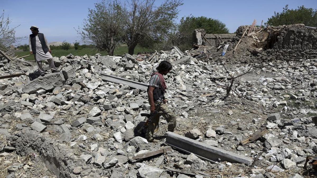 An Afghan security police officer at a destroyed house after an operation in Asad Khil near the site of a U.S. bombing in the Achin district of Jalalabad, east of Kabul, Afghanistan, April 17, 2017. U.S. forces in Afghanistan had struck an Islamic State tunnel complex in eastern Afghanistan earlier in the week with the largest non-nuclear weapon ever used in combat by the U.S. military, Pentagon officials said.