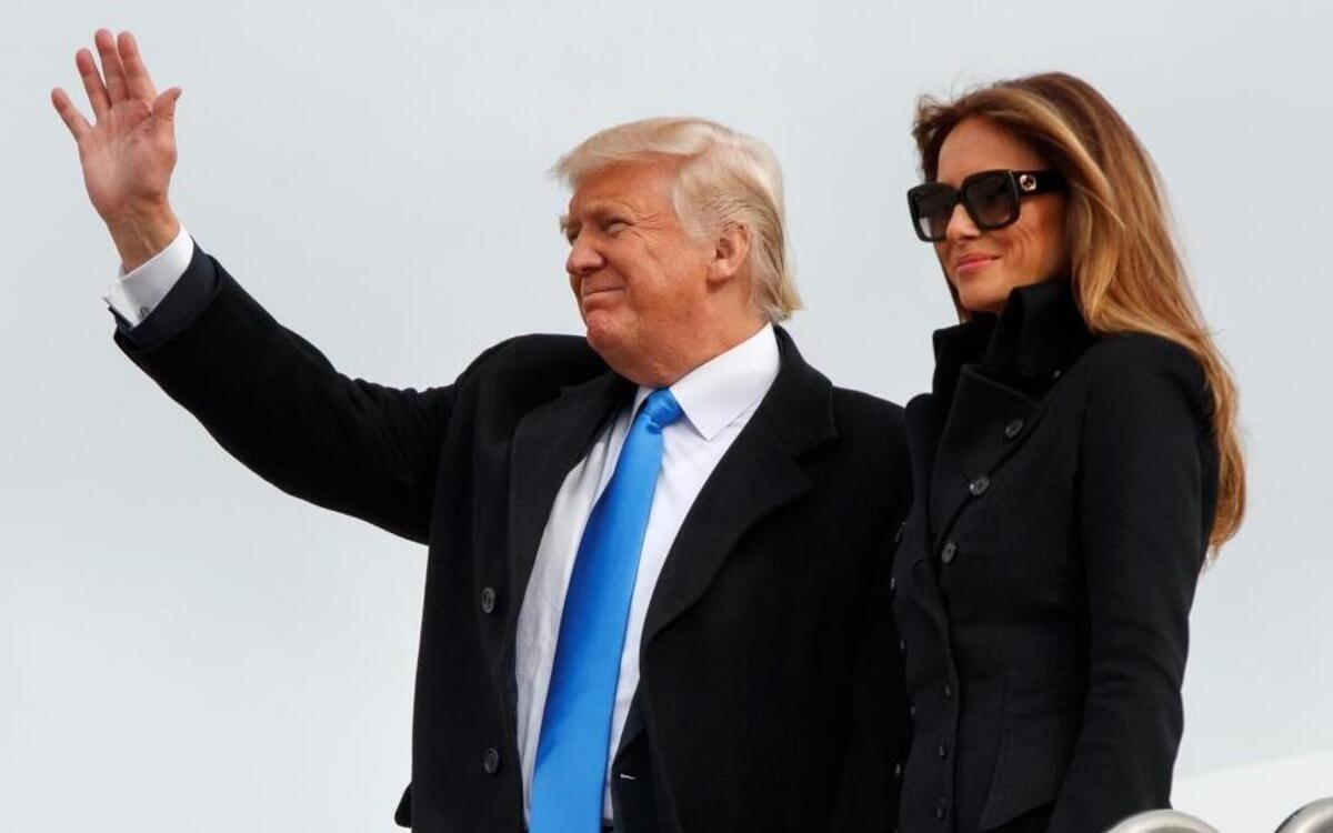 President-elect Donald Trump, accompanied by his wife, Melania Trump, waves as they arrive at Andrews Air Force Base, Md., Thursday, Jan. 19, 2017.