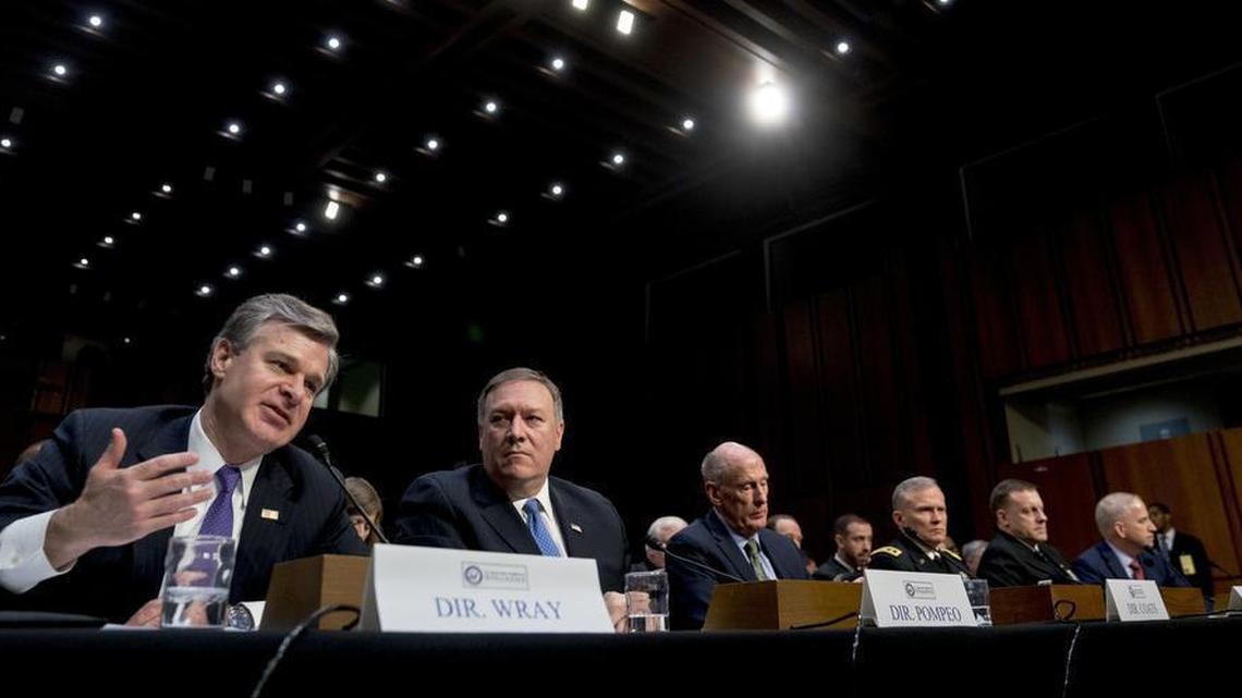 From left, FBI Director Christopher Wray, accompanied by CIA Director Mike Pompeo, Director of National Intelligence Dan Coats, Defense Intelligence Agency Director Robert Ashley, National Security Agency Director Adm. Michael Rogers, and National Geospatial-Intelligence Agency Director Robert Cardillo, speaks at a Senate Intelligence Committee hearing on worldwide threats Feb. 13, 2018.