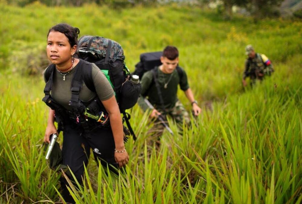 Women make up as much as 40 percent of leftist rebels. In this Jan. 6, 2016, photo, Gisell, 18, a rebel soldier of the 36th Front of the Revolutionary Armed Forces of Colombia, or FARC, treks to a new camp in Antioquia state, in the northwest Andes of Colombia.