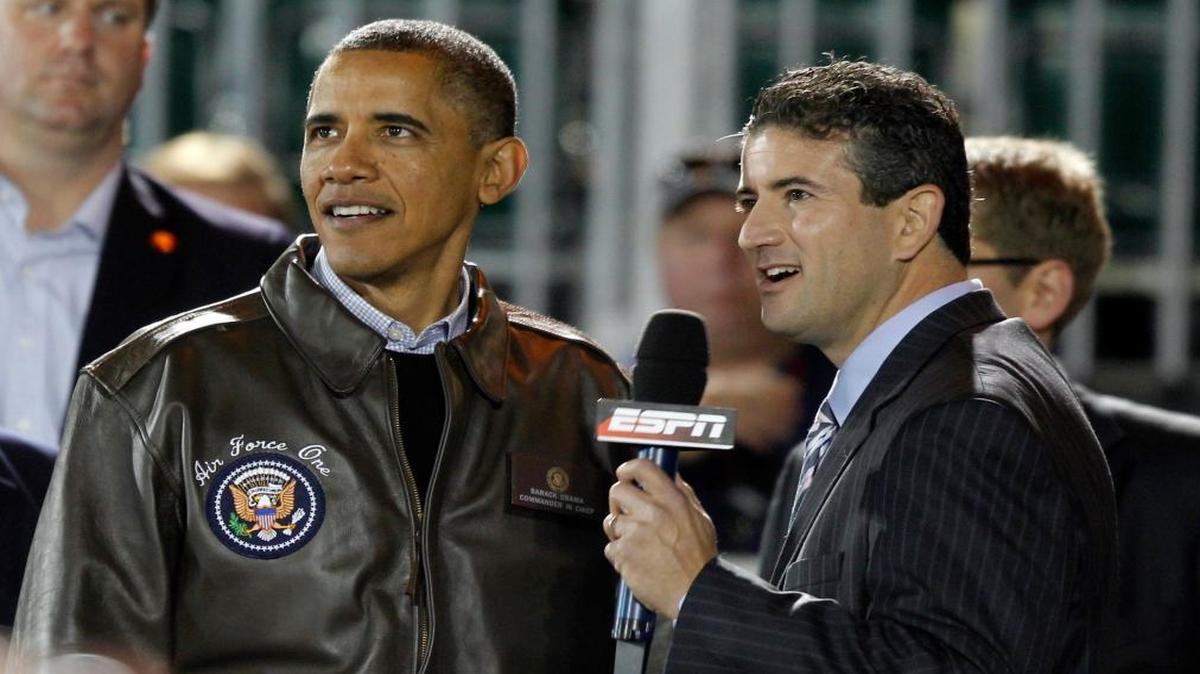 President Barack Obama stands with Andy Katz of ESPN before his interview at the Carrier Classic NCAA basketball game between Michigan State and North Carolina on the USS Carl Vinson, Friday, Nov. 11, 2011, in Coronado, Calif.