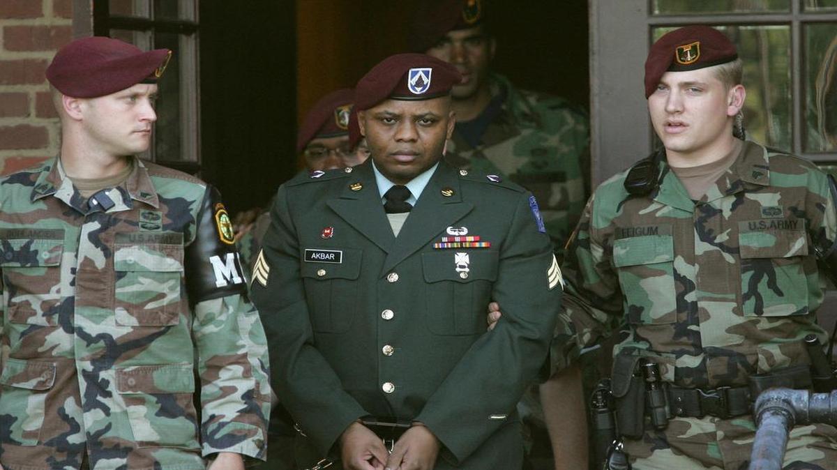 Sgt. Hasan Akbar, center, is led from the Staff Judge Advocate Building at Fort Bragg, N.C., on Monday, April 25, 2005, during the sentencing phase of his court-martial.
