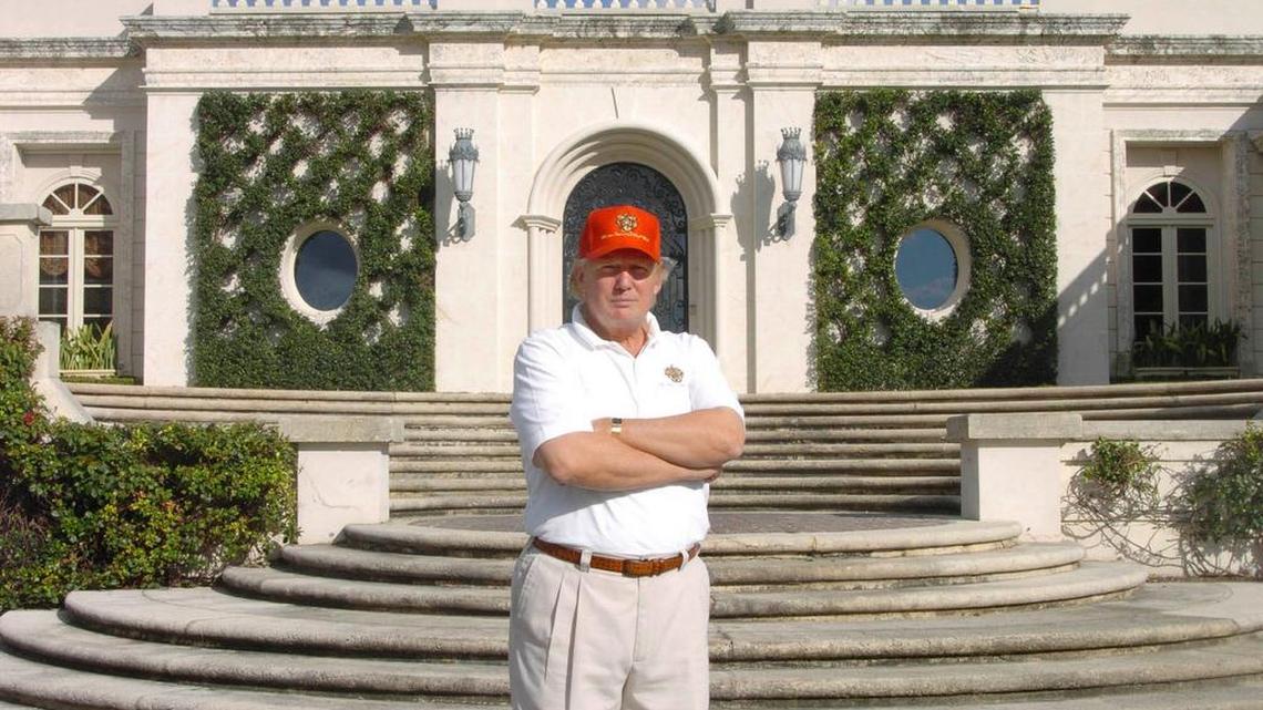 Photographed in 2005, Donald Trump stands in front of 515 N. County Rd., the estate he bought at auction for about $41 million, renovated and then sold in 2008 at a recorded $95 million.