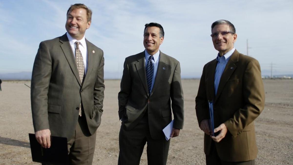 From left, Sen. Dean Heller, R-Nev., Nevada Governor Brian Sandoval and Rep. Joe Heck, R-Nev., attend an event to announce the FAA's first issuance of an unmanned aerial systems test site special airworthiness certificate Friday, Dec. 19, 2014, near Boulder City, Nev.