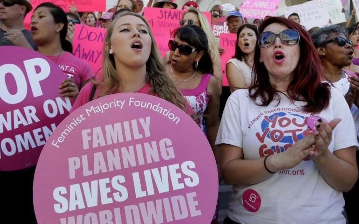 Planned Parenthood supporters rally for women's access to reproductive health care on "National Pink Out Day'' in November 2015 at Los Angeles City Hall.