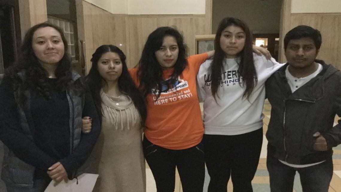 Students from the Western Washington University Blue Group, a club for undocumented immigrants and allies, pose for a photo after speaking at Bellingham City Council on Monday, Nov. 14, to ask the council to declare Bellingham a sanctuary city.