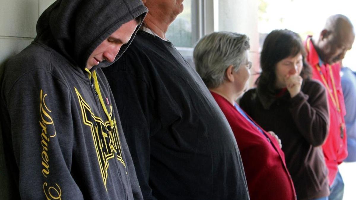 Patients waited for medical care outside a free health clinic in Biloxi, Mississippi, in 2013. Repeal of the Affordable Care Act will add millions to the rolls of the uninsured.