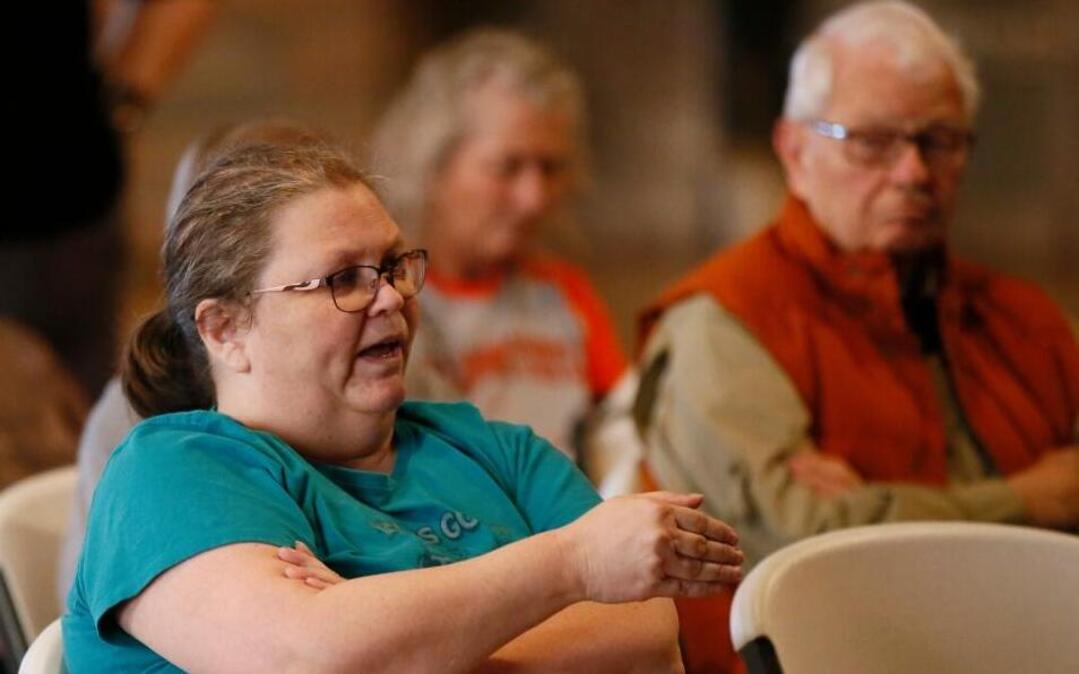 Pattye McAbee, of Carney, Okla., asks a question of U.S. Rep. Frank Lucas, R-Oklahoma, during a town hall meeting in Chandler, Okla., Wednesday, Feb. 22, 2017. McAbee said that she had voted for Hillary Clinton and wanted Congress to leave Obamacare alone.