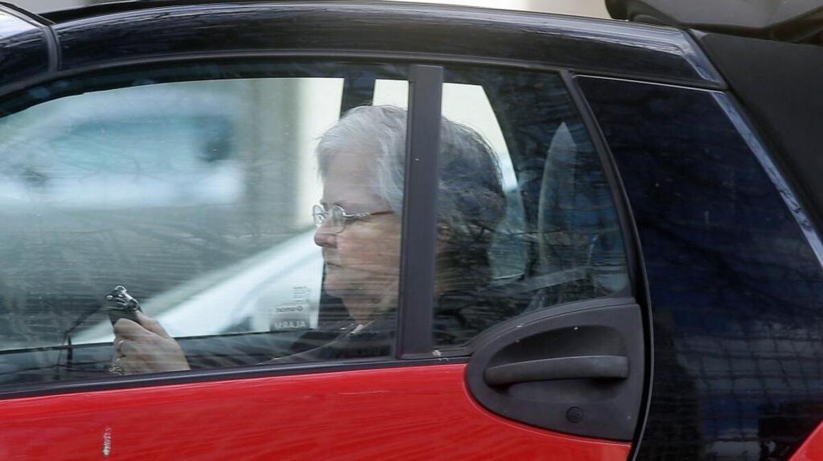 A driver texts as she makes her way through traffic in Dallas, Monday, March 6, 2017.