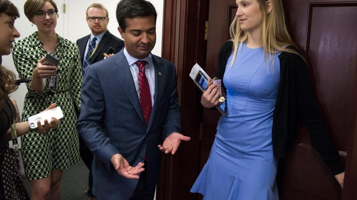 Rep. Carlos Curbelo, R-Fla. is followed by reporters as he arrives for the Republican Caucus meeting on Capitol Hill.
