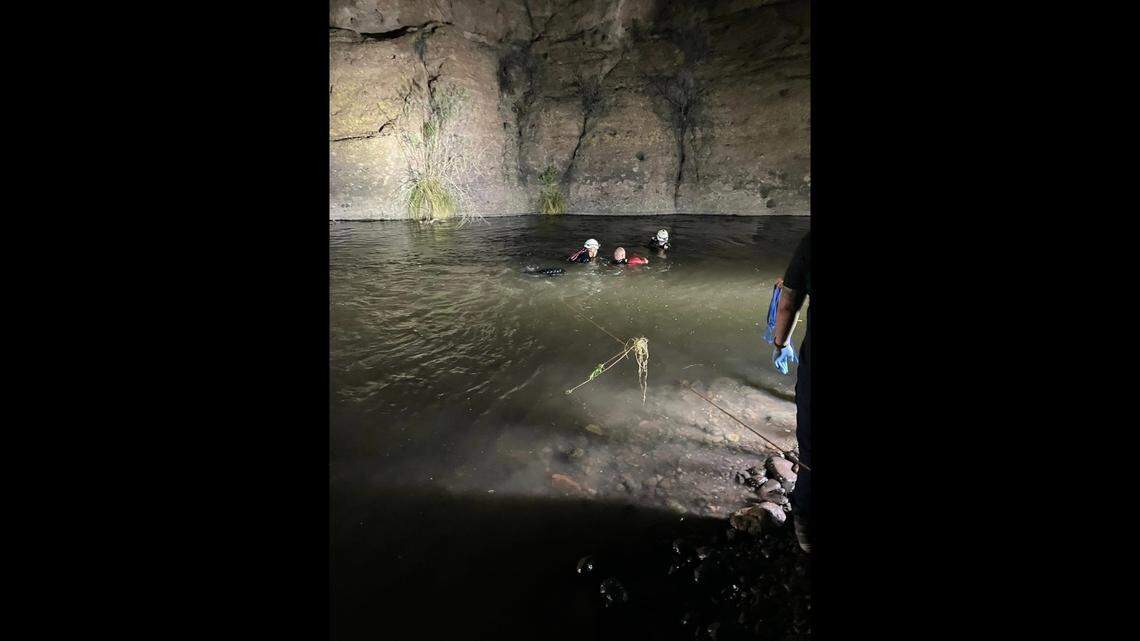 Rescuers are in the creek where the side-by-side vehicle went in.