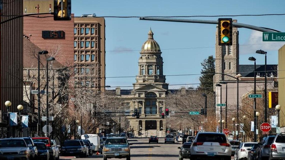 The Wyoming State Capitol building framed by downtown Cheyenne, Wyo. Wyoming is the least populous and the second least densely populated of the 50 United States but a very popular location for the formation of offshore corporations because one can set up a LLC in Wyoming without one's name having to be in the State Register.