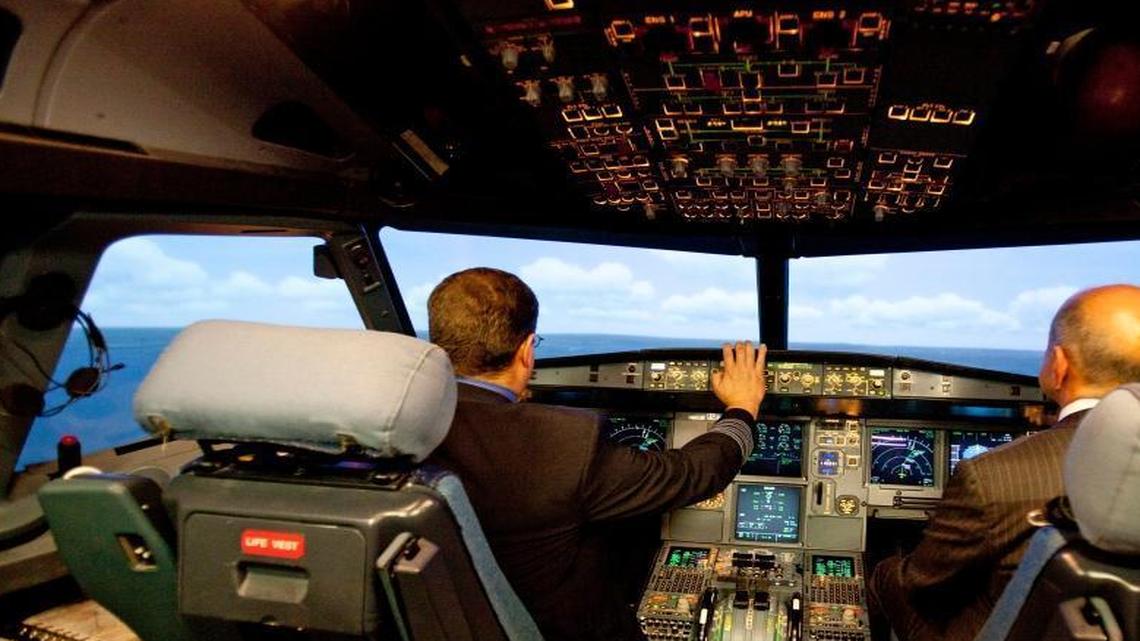Jet Blue pilot, Captain Joe Devito, left, navigates a NextGen flight simulator with FAA Administrator Michael Huerta at a Jet Blue facility in Orlando, Fla on Sept. 20, 2012. President Trump and many lawmakers want to privatize parts of the FAA, in part because of the agency’s delays in implementing the NextGen system, which uses GPS and other high-tech systems to manage air traffic control.