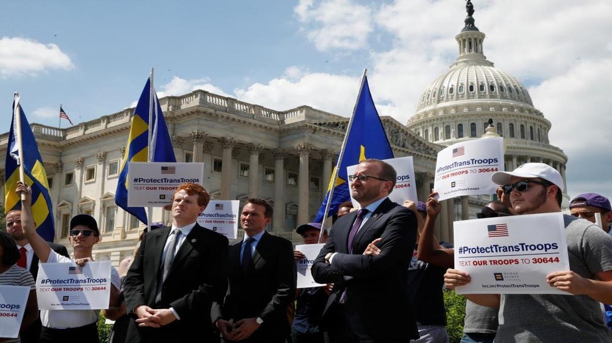 Rep. Joe Kennedy, D-Mass., third from right, listens during an event in support of transgender members of the military, Wednesday, July 26, 2017, on Capitol Hill in Washington, after President Donald Trump said he wants transgender people barred from serving in the U.S. military "in any capacity," citing "tremendous medical costs and disruption."