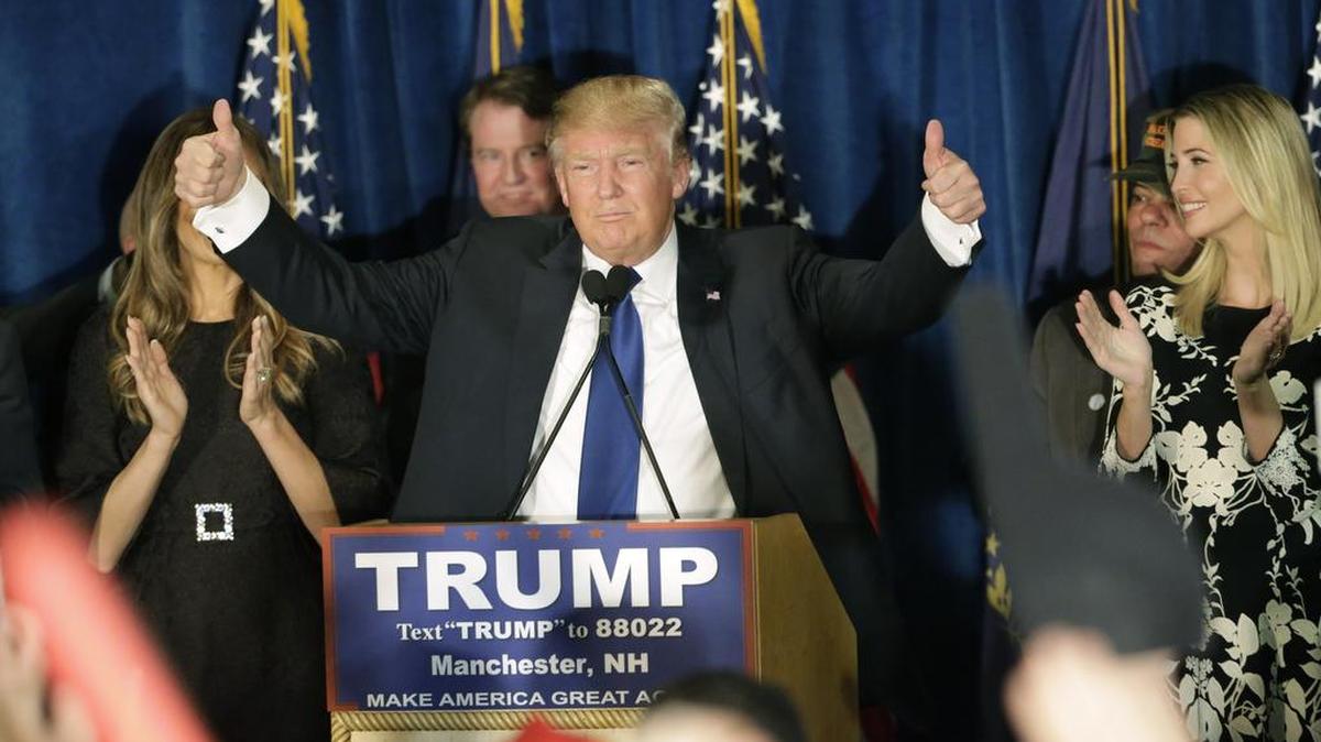 Republican presidential candidate, businessman Donald Trump gives thumbs up to supporters during a primary night rally, Tuesday, Feb. 9, 2016, in Manchester, N.H.