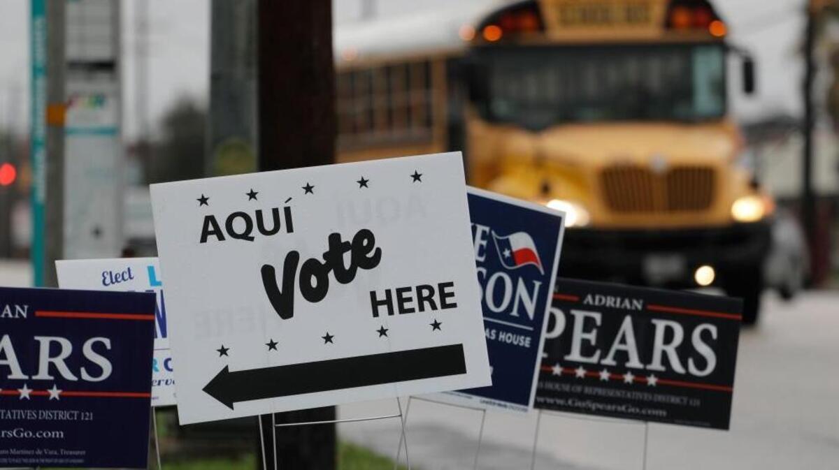 Signs mark a polling site as early voting begins, in San Antonio. Democrats in Texas are early voting in bigger numbers ahead of the nation's first primary elections of the 2018 midterms.