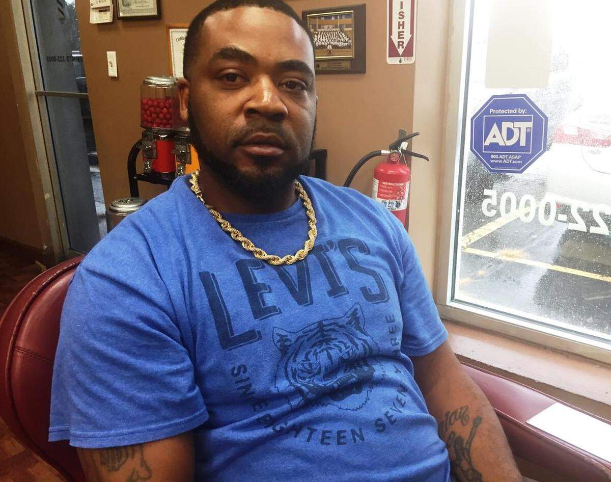Brian McGhee, a barber in Warner Robins, Georgia, borrowed money from a title-pawn company and said he got caught in debt trap.He paid monthly thinking he was paying down the loan but it mostly went to fees and interest.