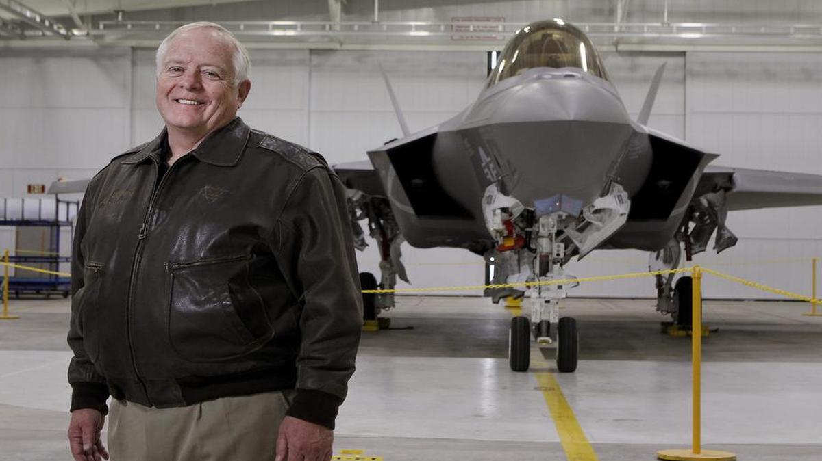 Jon Beesley, the first F-35's first test pilot, stands in front of stealth fighter at Lockheed Martin in Fort Worth.