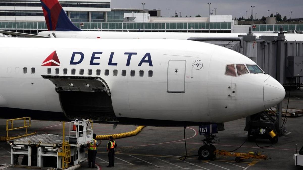 Passengers disembarking a domestic Delta flight in New York were asked to show identification before they got off the plane.