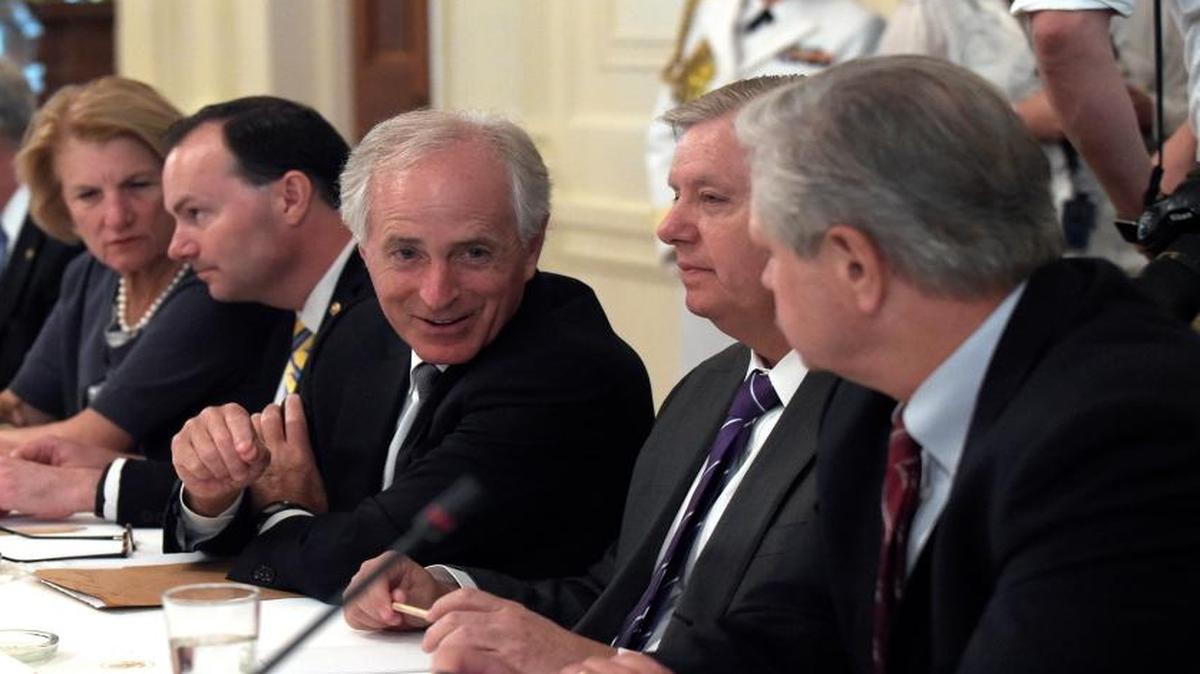 Sen. Bob Corker, R-Tenn., third from right, talks with Sen. Lindsey Graham, R-S.C., second from right, and Sen. John Hoeven, R-N.D., right as they wait for President Donald Trump to join a meeting of Republican senators on health care in the East Room of the White House in Washington, Tuesday, June 27, 2017. Others a the table are, from left, Sen. Ted Cruz, R-Texas, Sen Ron Johnson, R-Wis., Sen. Shelley Moore Capito, R-W.Va., and Sen. Michael S. Lee, R-Utah.