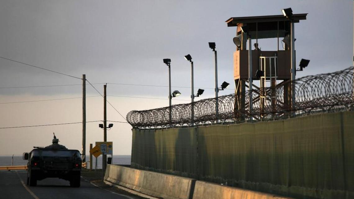 A U.S. trooper stands in the turret of a vehicle with a machine gun, left, as a guard looks out from a tower at the detention facility of Guantanamo Bay U.S. Naval Base in Cuba. President Barack Obama’s quest to close the prison at Guantanamo Bay, perhaps by moving some detainees to the United States, has sparked concerns that he’ll try to move the detainees to the United States.