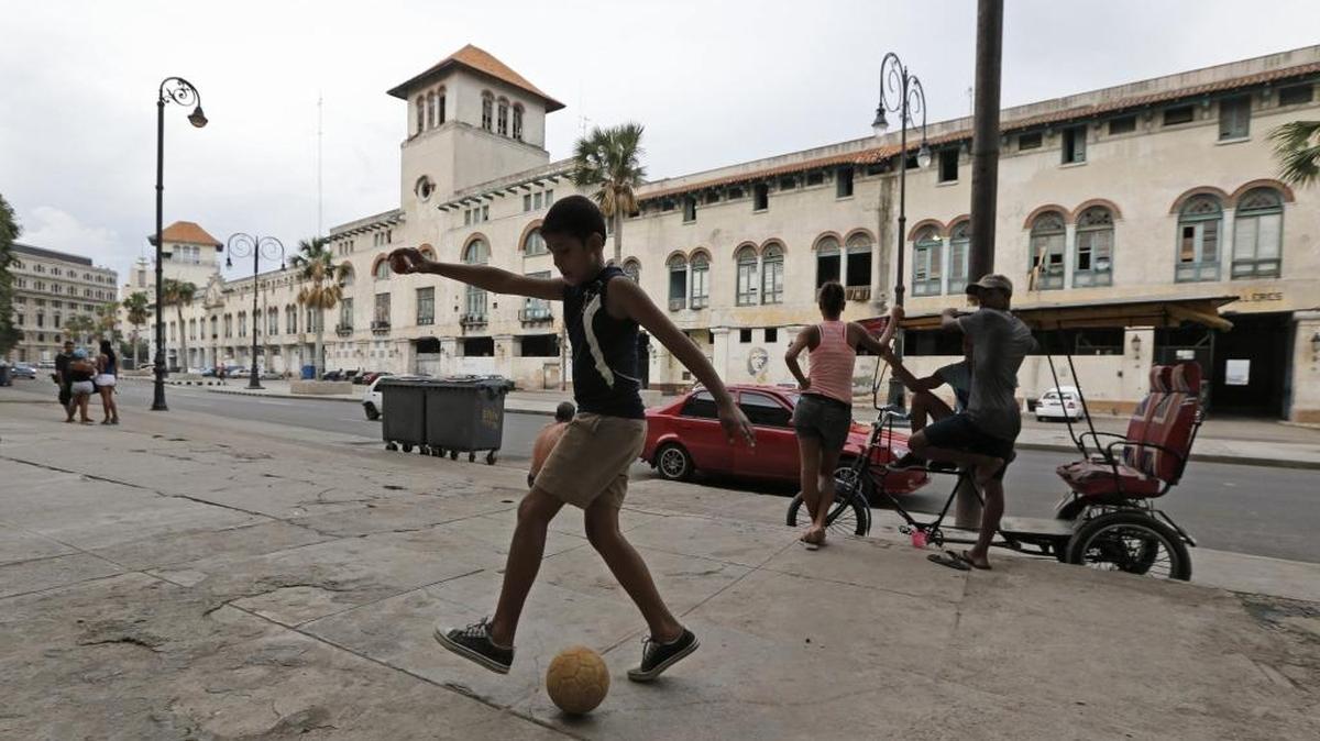 Dylan Batista, 11, plays soccer across the Sierra Maesta Terminal at the Port of Havana, Cuba, on Sept. 18, 2015. The terminal is being renovated for tourism after all existed commercial activity transferred to Mariel Harbor.
