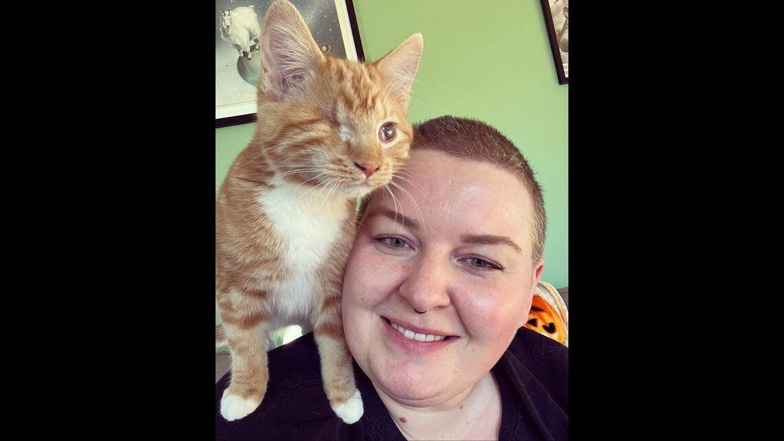 Jessica Means is pictured with Luckee on her shoulders. The orange kitten was adopted Nov. 15 from the Idaho Humane Society in Boise.