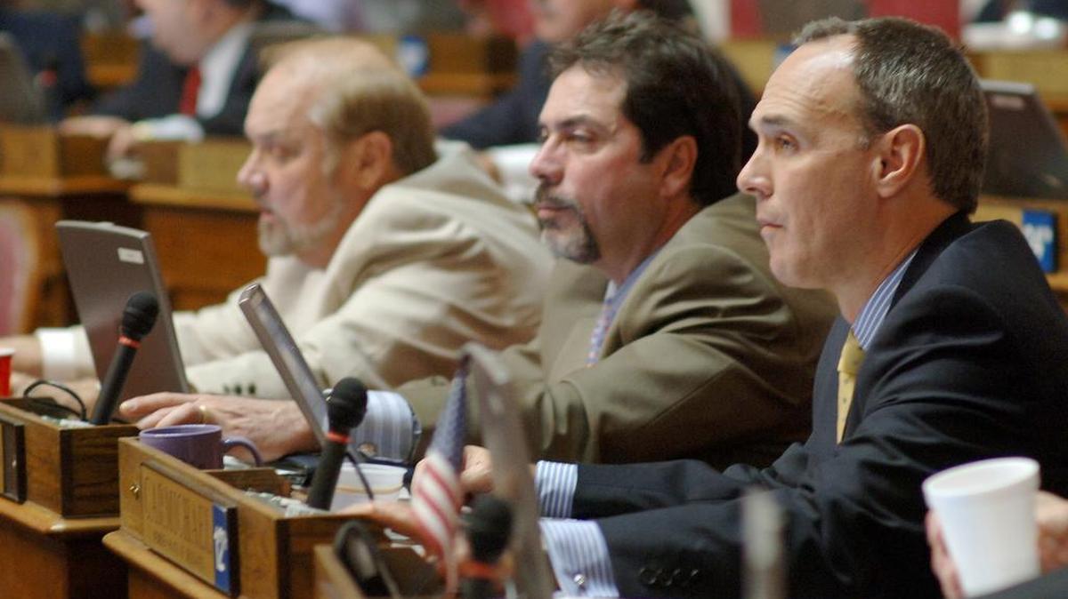 Mitch Carmichael, right, (R-Jackson) votes in the House chambers of the West Virginia State Capitol on the final day of the legislative session in Charleston, W.Va. Saturday, April 9, 2005.