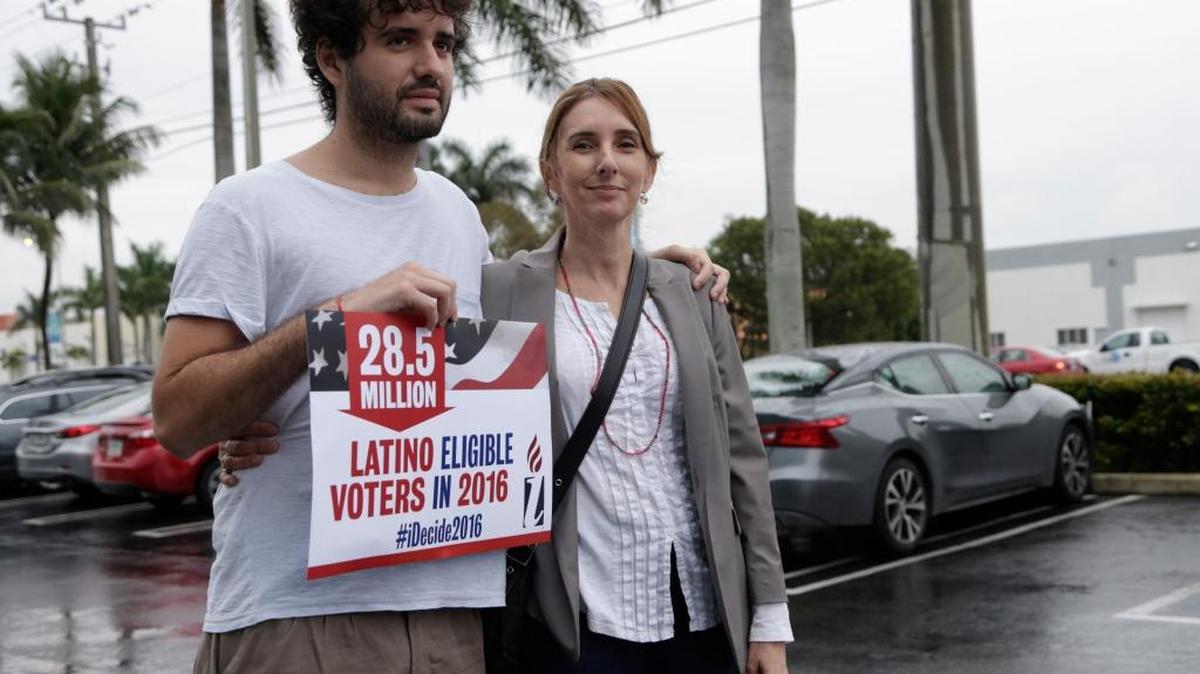 Tomas Kennedy, 24, of Miami, left, poses with his mother, Maria Bilbao, an undocumented immigrant from Argentina, during a protest Tuesday outside the office of Rep. Carlos Trujillo.
