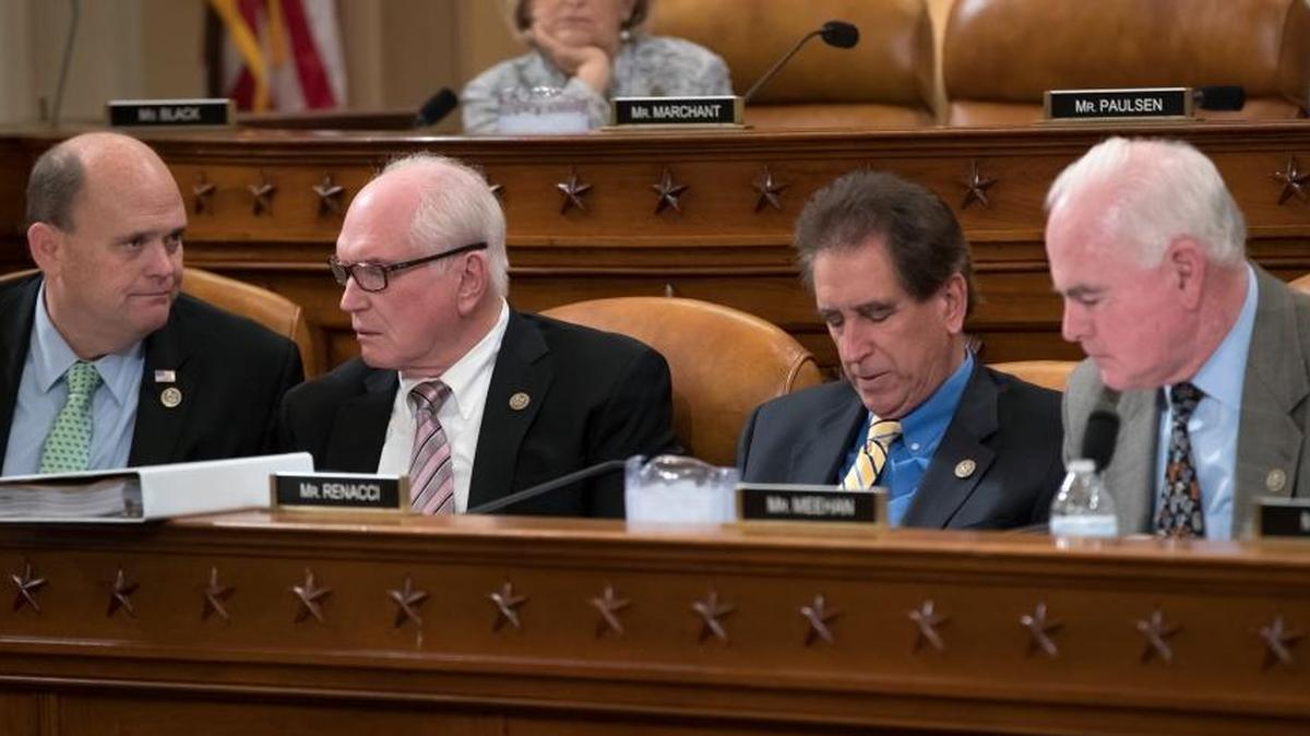 Republican members of the House Ways and Means Committee, from left, Rep. Tom Reed, R-NY, Rep. Mike Kelly, R-Pa., Rep. Jim Renacci, R-Ohio, and Rep. Pat Meehan, R-Pa., with Rep. Diane Black, R-Tenn., at top, work on the markup of the GOP's far-reaching tax overhaul.