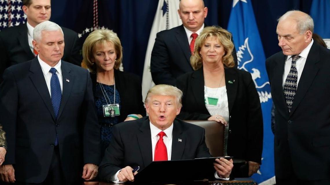 President Donald Trump, accompanied by Vice President Mike Pence, Homeland Security Secretary John F. Kelly, and others, speaks during a visit to the Homeland Security Department in Washington, Wednesday, Jan. 25, 2017.