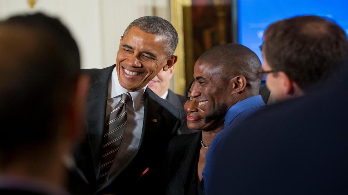 
President Barack Obama stops to pose for a photograph with Terrence Wise, right, and Wise's mom Joann Wise, center, during the White House Summit on Worker Voice, Wednesday, Oct. 7, 2015, in the East Room of the White House in Washington. The summit is an effort to give unions, organizers and some businesses a platform to discuss wages and other issues. Terrence Wise is a second-generation fast food worker from Kansas City, Mo. 
