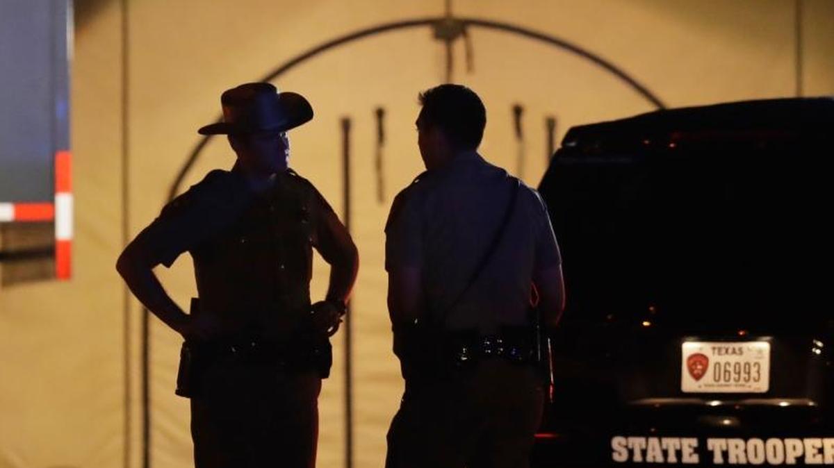 Law enforcement officials work at the scene of a shooting at the First Baptist Church of Sutherland Springs, Sunday in Sutherland Springs, Texas. A man dressed in black tactical-style gear and armed with an assault rifle opened fire inside the church in the small South Texas community on Sunday, killing and wounding many. The dead ranged in age from 5 to 72 years old.