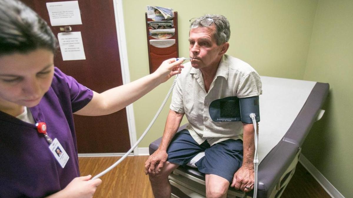 Terry Brewster, a construction worker, visits his primary care physician, Dr. Paul Cohen, at Little River Medical Center. Brewster, dealing with high blood pressure and arthritis, is among millions of people with pre-existing conditions who could face higher premiums if the GOP wins passage of a proposal to let individual insurers charge sick people more for coverage.