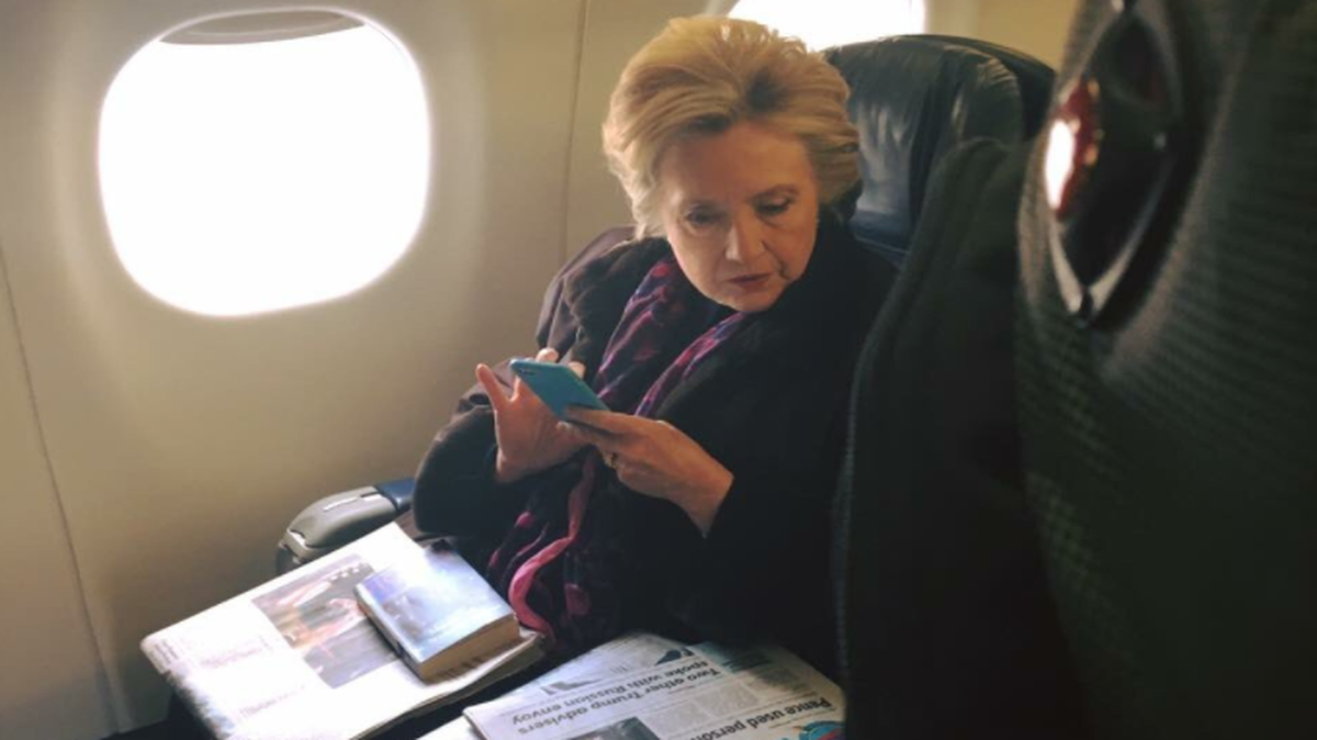 A fellow passenger captured this photograph of former Democratic presidential nominee Hillary Clinton on a flight Friday.
